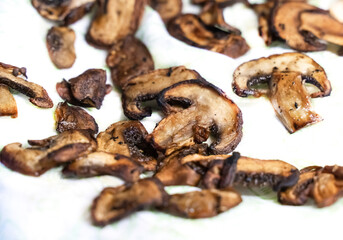 fried champignon sliced into slides on white isolated background