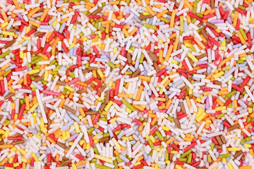 Fototapeta na wymiar Top view of colorful sugar sprinkles