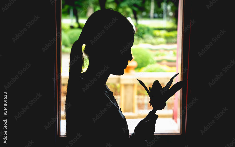 Wall mural Beautiful Asian girl at big Buddhist temple dressed in traditional costume