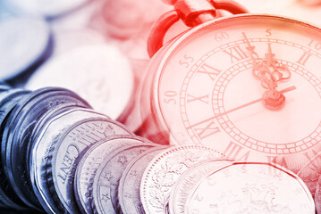 Time is money, time value of money concept : Coins and vintage brass pocket watch, idea of time...