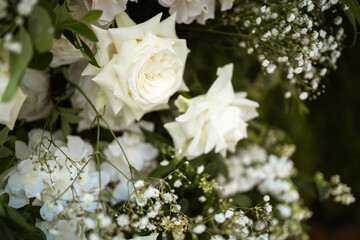 Close up of wedding decorations, with white fresh flowers. Tender wedding arrangements.