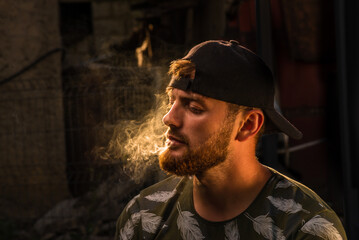 Handsome Young caucasian men, man with stubble beard, Portrait man with cigar and smoke isolated on...