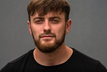 Fototapeta premium Handsome Young caucasian men, man with stubble beard, Portrait of smiling, shirt in the countryside, on gray background, nature, sexy men bodybuilder, summer day, Blond ginger