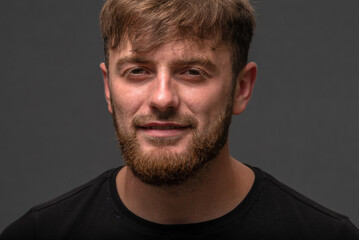 Obraz premium Handsome Young caucasian men, man with stubble beard, Portrait of smiling, shirt in the countryside, on gray background, nature, sexy men bodybuilder, summer day, Blond ginger