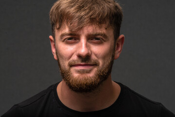 Obraz premium Handsome Young caucasian men, man with stubble beard, Portrait of smiling, shirt in the countryside, on gray background, nature, sexy men bodybuilder, summer day, Blond ginger