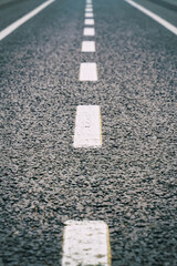 Fototapeta premium asphalt road markings white line, broken line traffic indicator