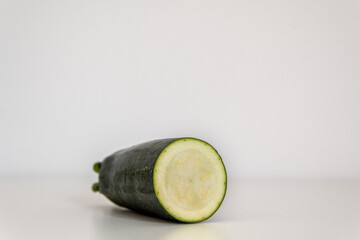 Sliced zucchini in front of a white background