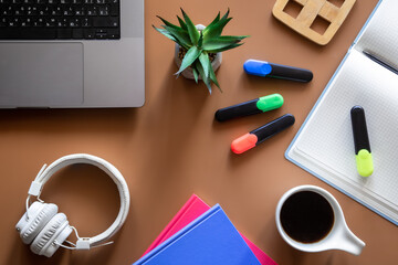 Multicolored stationery at the workplace of a schoolboy flat lay.