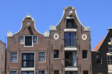Amsterdam Nieuwezijds Voorburgwal Street Traditional Brick House Facades with Bell Gables, Netherlands