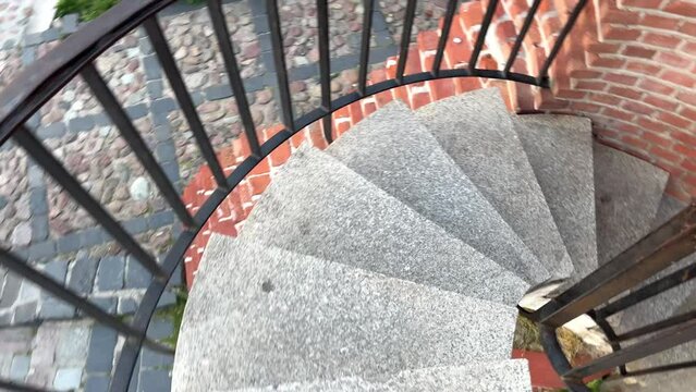 spiral staircase descent down Warsaw Poland central square of the old town. High quality 4k footage