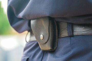 Formation of the Russian police squad rear view, side view. A policeman with a pistol holster, handcuffs, a taser and a holster.A law enforcement officer wears a duty belt, with a pistol, handcuffs. 