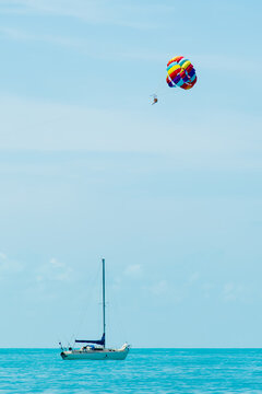 Rainbow parachute on the background of the blue sea and sky. Landscape. Summer. Vacation.