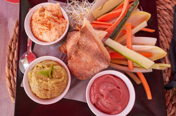Hummus variety served with fresh vegetables