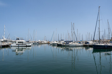 Sleek and modern sailboats and motor boats in a central marina in Antibes, France. Yachts and speed boats in the port.