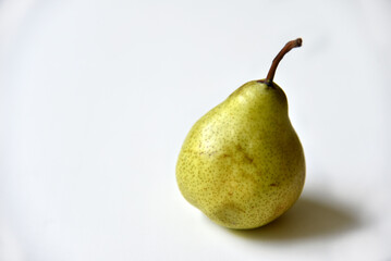 Green delicious pear on a white background