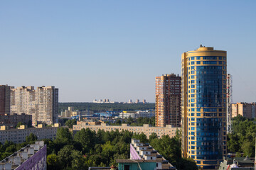 Fototapeta na wymiar Panoramic top view of the city of Reutov Moscow region with modern tall houses among green trees on a bright sunny summer day