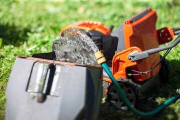washing a lawn mower