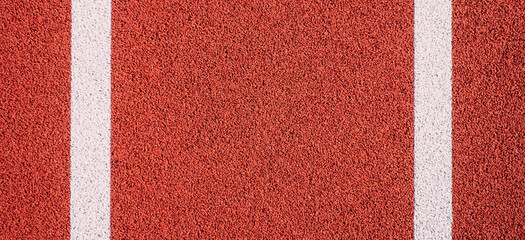 Colorful sports court background. Top view to red field rubber ground with white lines outdoors