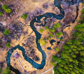 Aerial top down view plain river Psel during spring time. Beautiful valley of riverbed with green...