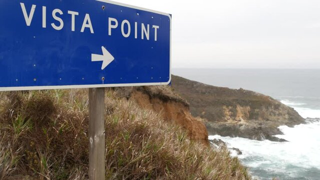 Vista point road sign, rocky craggy ocean shore, waves crashing on beach. California scenic pacific coast cabrillo highway 1, Big Sur nature, USA. Seascape viewpoint, lookout from cliff or steep bluff