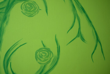 floral pattern painted on the wall, green abstract crooked shape on green light background, green wallpaper