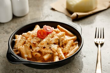 Red pasta served in a dish isolated on grey background side view fast food
