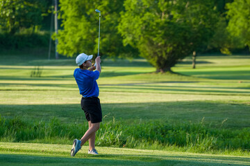 Junior golf on a beautiful day on the course