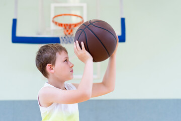 School kid playing basketball in a physical education lesson. Horizontal education poster, greeting cards, headers, website
