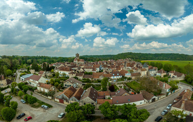 Fototapeta na wymiar Aerial view of Noyers village in the pretty setting of the Chablis countryside on the banks of the River Serein a real-life history book With the cobbled streets lined with half-timbered houses 