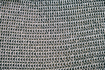 Medieval vintage chain mail, background. Reconstruction of the events of the Middle Ages in Europe.