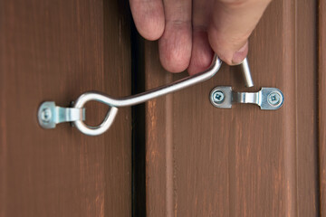 Security hook and eye door lock for doors locking of country house.