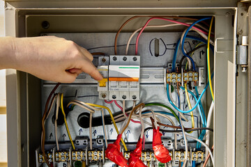 Consumer unit switchboard with fuse box circuit breakers.