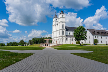 White Catholic Church on the background of blue sky