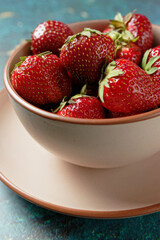 Close up view of ripe strawberries in a bowl