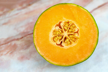 Cut melon. Seeds inside a ripe melon.