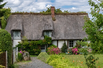 A thatched cottage in Normandy, on the banks of the Seine, beautiful house

