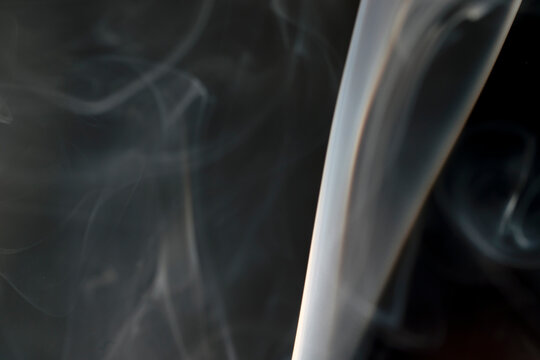 photo of drifting smoke in the dark, background.