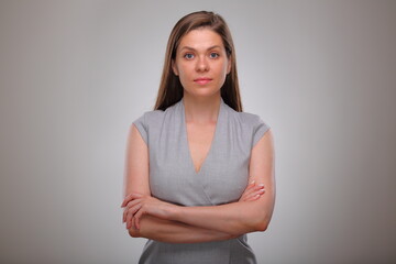 Isolated business woman portrait with arms crossed, serious business person, teacher or adult student