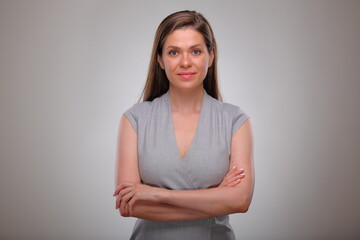 Obraz premium Isolated business woman portrait with arms crossed, smiling business person, teacher or adult student