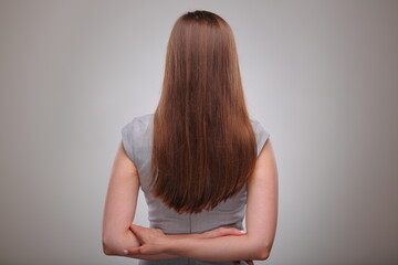 Isolated business woman back view portrait with hands crossed behind, business person, teacher or...
