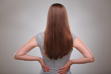 Isolated business woman back view portrait, business person, teacher or adult student with long hair.