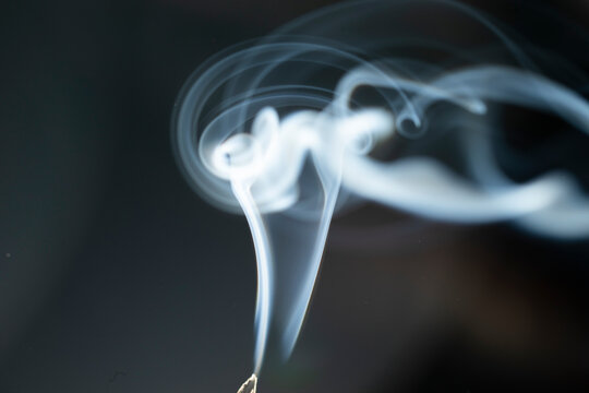 photo of drifting smoke in the dark, background.