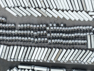 Parking for white trucks with trailers. Aerial view of industrial place. 