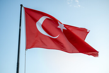 Turkish flag against blue sky