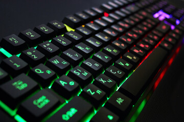 Gaming keyboard with RGB light on black - obrazy, fototapety, plakaty