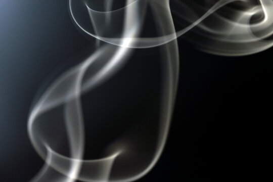 photo of drifting smoke in the dark, background.
