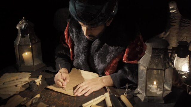 Communication in the Ottoman Empire.
The Ottoman sultan writes a letter by candlelight. Arabic script.
