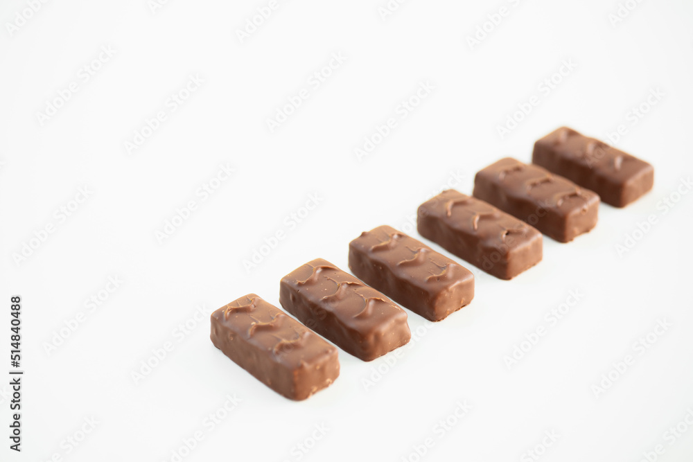 Wall mural chocolate candy bar on white background