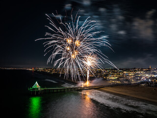 Manhattan Beach Pier in California with Fireworks over head.