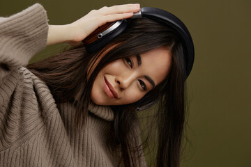 Fototapeta premium portrait woman in headphones listening to music emotions isolated background